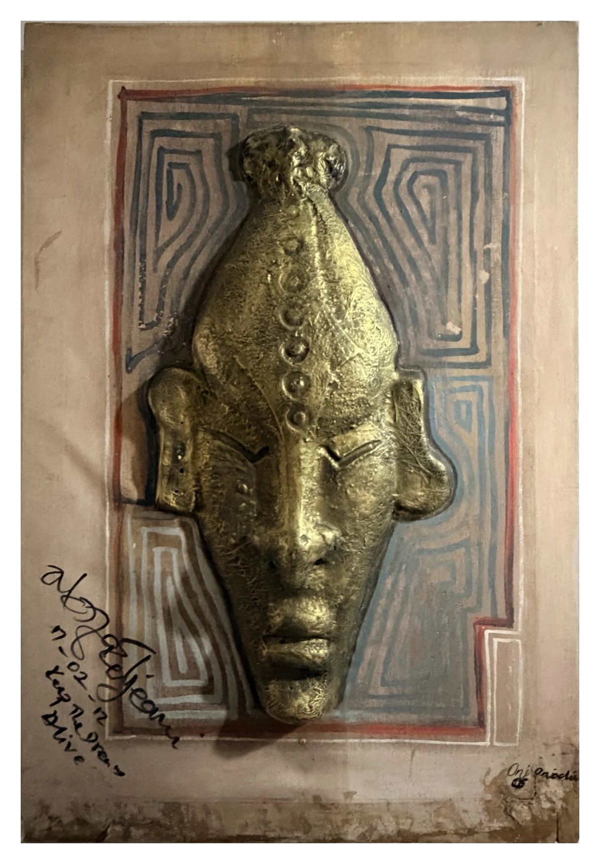 Collection photograph: a face in relief.